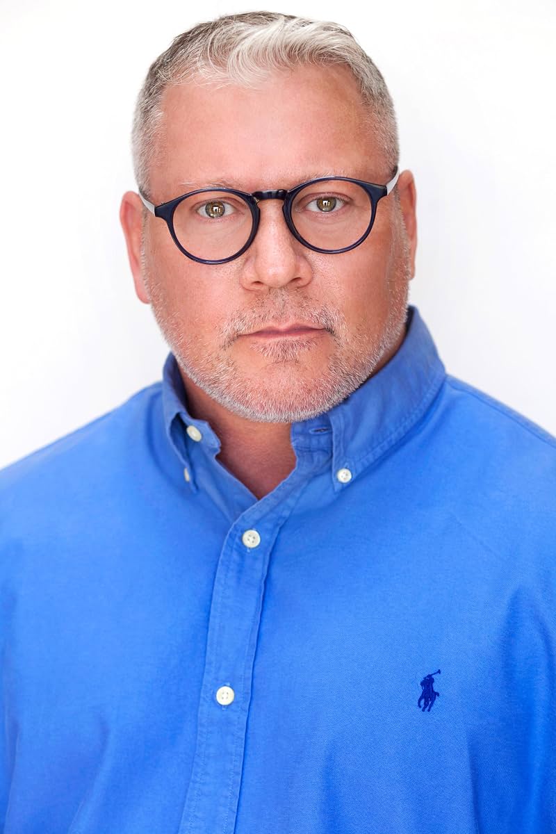 Benjamin Poe — headshot wearing glasses