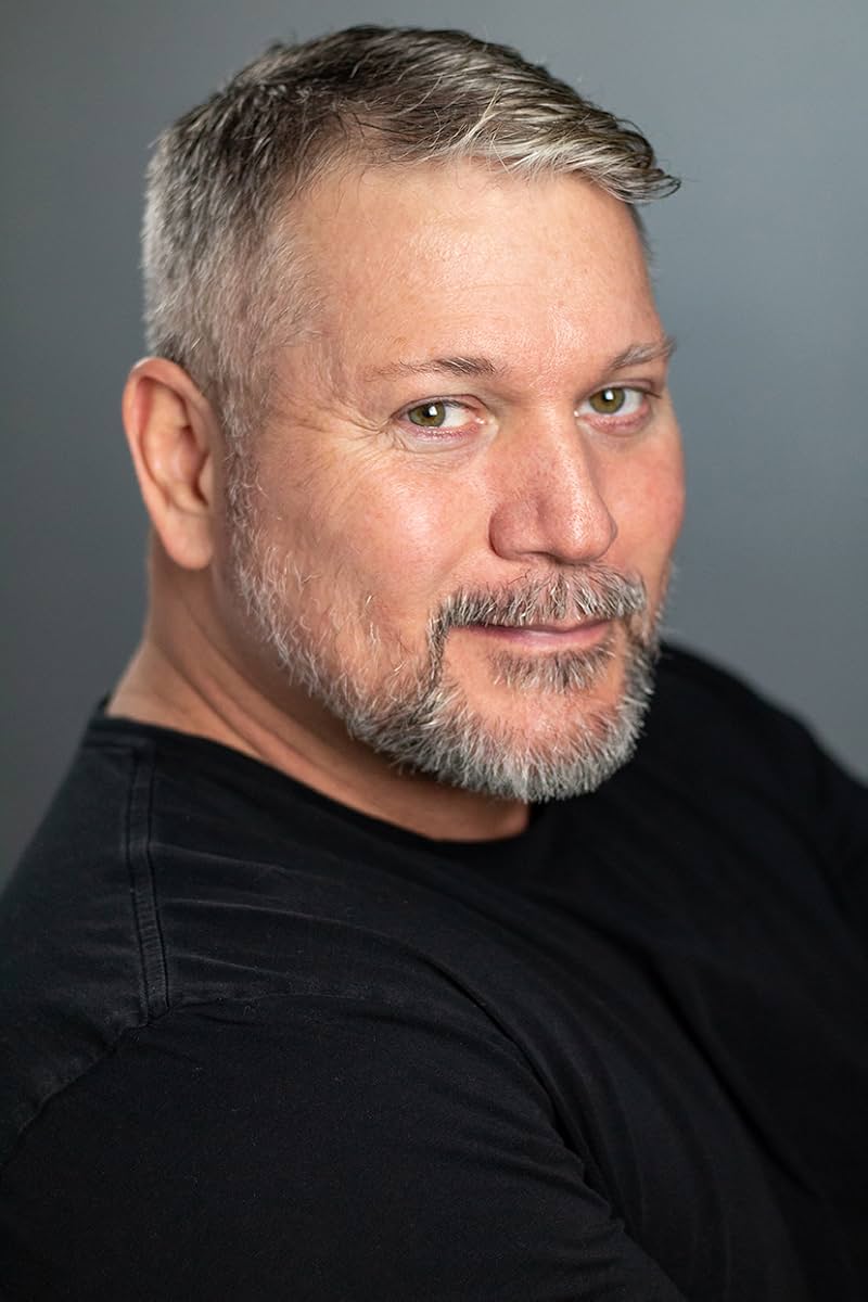 Benjamin Poe — three-quarter studio headshot