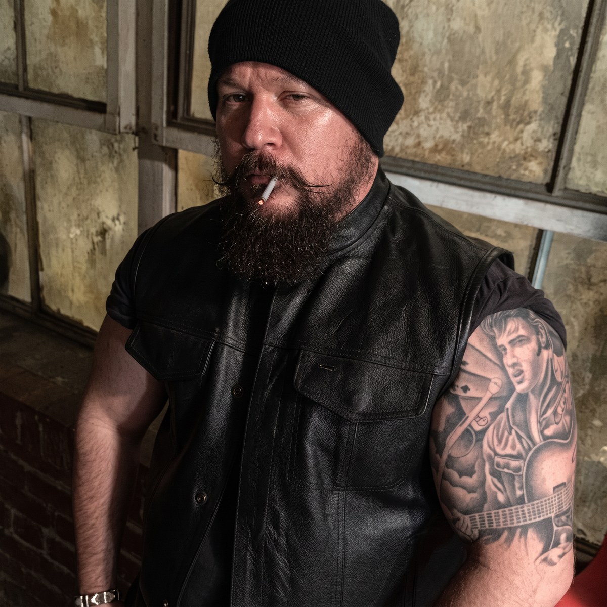 Benjamin Poe — character still with Elvis tattoo